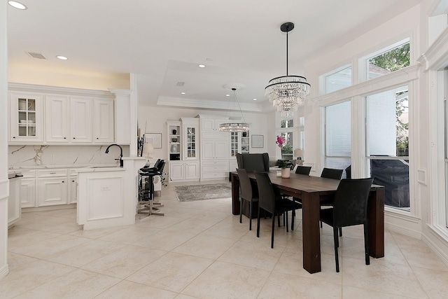 26 W Fairbranch Cir, The Woodlands, TX 77382 - dining room featuring a chandelier, crown molding, recessed lighting, and light tile patterned floors