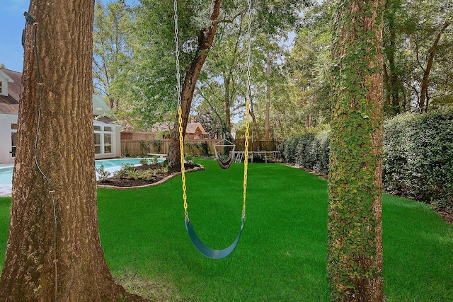 26 W Fairbranch Cir, The Woodlands, TX 77382 - fenced backyard with a putting green