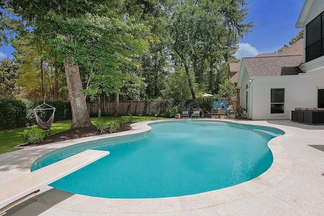 26 W Fairbranch Cir, The Woodlands, TX 77382 - view of swimming pool featuring a fenced backyard, a diving board, and a patio area