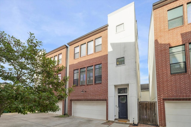 1408 Ruthven St, Houston, TX 77019 - view of property with an attached garage and driveway