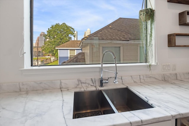 1408 Ruthven St, Houston, TX 77019 - kitchen view of a sink and light stone counters