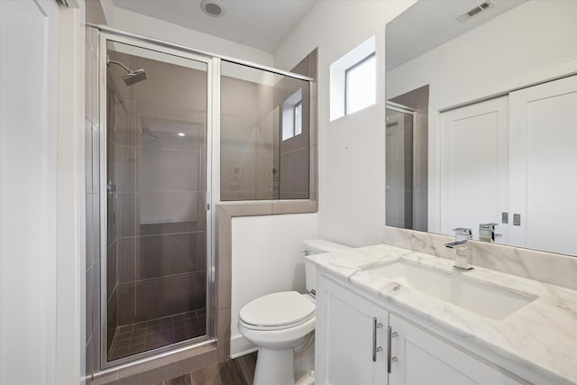 1408 Ruthven St, Houston, TX 77019 - bathroom with vanity, a shower stall, and wood finished floors