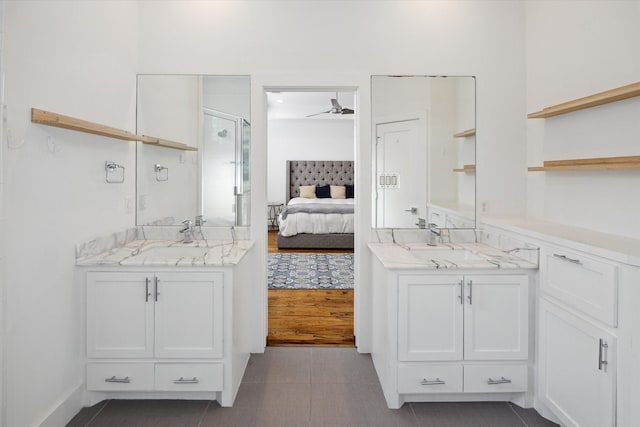 1408 Ruthven St, Houston, TX 77019 - ensuite bathroom with two vanities, a stall shower, and tile patterned flooring