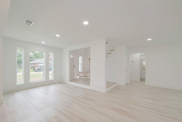 17802 Poppy Trails Ln, Houston, TX 77084 - unfurnished room with stairway, light wood finished floors, and recessed lighting