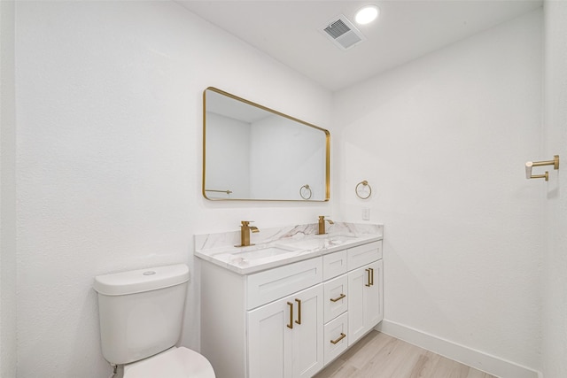 17802 Poppy Trails Ln, Houston, TX 77084 - bathroom featuring double vanity and wood finished floors