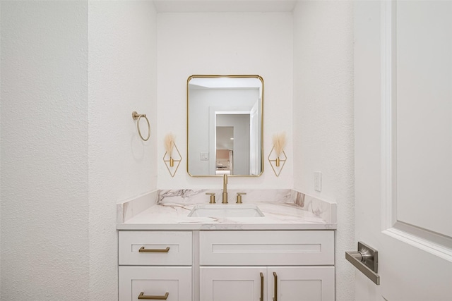 17802 Poppy Trails Ln, Houston, TX 77084 - bathroom featuring vanity and a textured wall