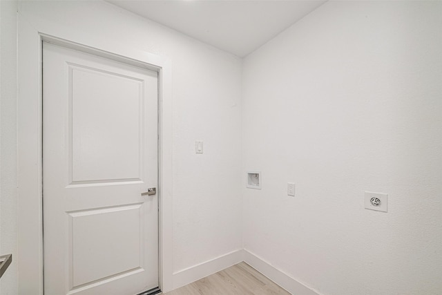 17802 Poppy Trails Ln, Houston, TX 77084 - laundry room featuring hookup for an electric dryer, light wood-style flooring, and hookup for a washing machine