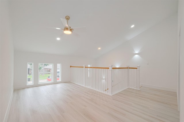 17802 Poppy Trails Ln, Houston, TX 77084 - empty room with light wood-style floors, a ceiling fan, vaulted ceiling, and recessed lighting