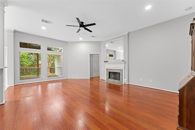 3406 Mcmahon Way, Missouri City, TX 77459 - unfurnished living room with a ceiling fan, a fireplace, wood finished floors, and recessed lighting