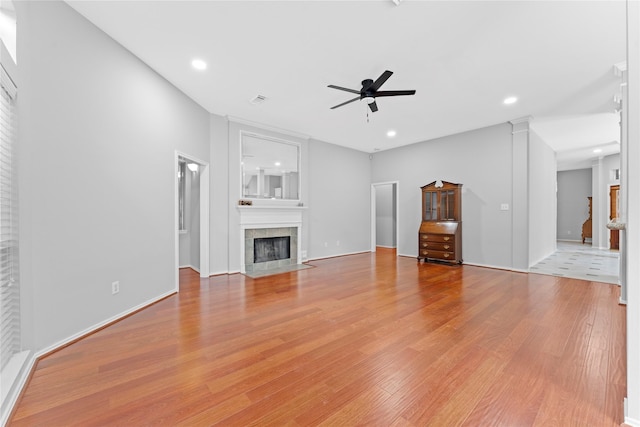 3406 Mcmahon Way, Missouri City, TX 77459 - unfurnished living room with a ceiling fan, light wood-type flooring, a fireplace, and recessed lighting