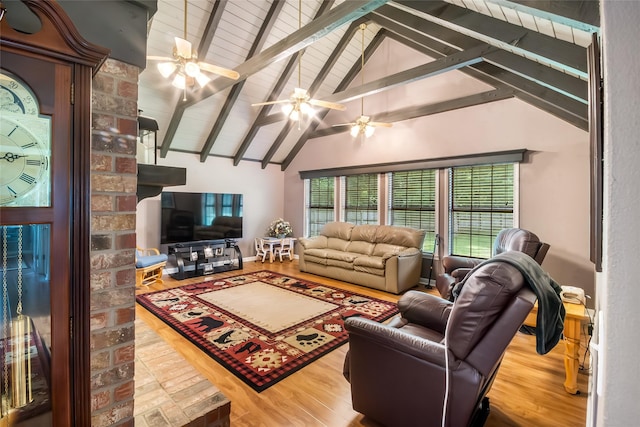 24917 W Christine Dr, Splendora, TX 77372 - living area with wood finished floors, beamed ceiling, high vaulted ceiling, and a ceiling fan