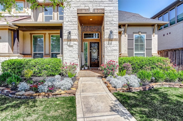 28606 Royal Pines Ct, Fulshear, TX 77441 - view of exterior entry featuring stucco siding and stone siding