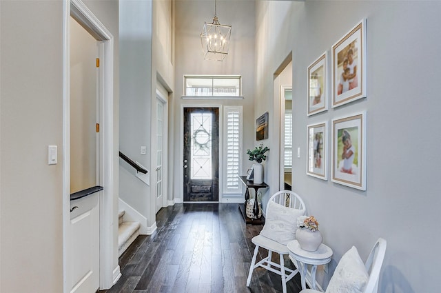 28606 Royal Pines Ct, Fulshear, TX 77441 - entryway with dark wood-style flooring, a chandelier, stairway, and a high ceiling