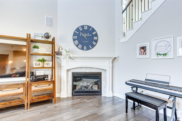 28606 Royal Pines Ct, Fulshear, TX 77441 - living area with wood finished floors and a tile fireplace
