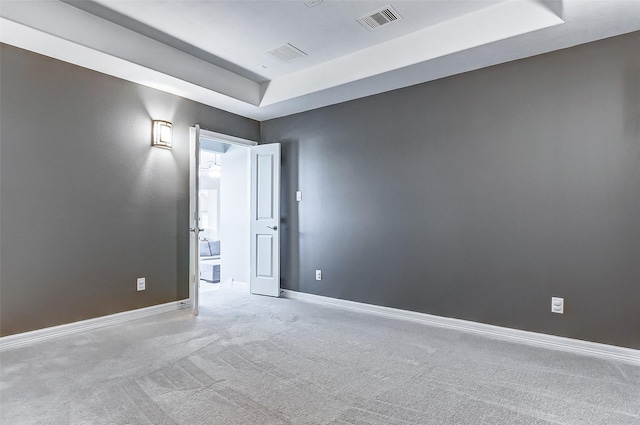 28606 Royal Pines Ct, Fulshear, TX 77441 - carpeted empty room featuring a raised ceiling and baseboards