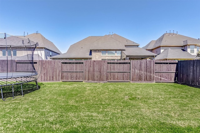 28606 Royal Pines Ct, Fulshear, TX 77441 - fenced backyard with a trampoline and a gate