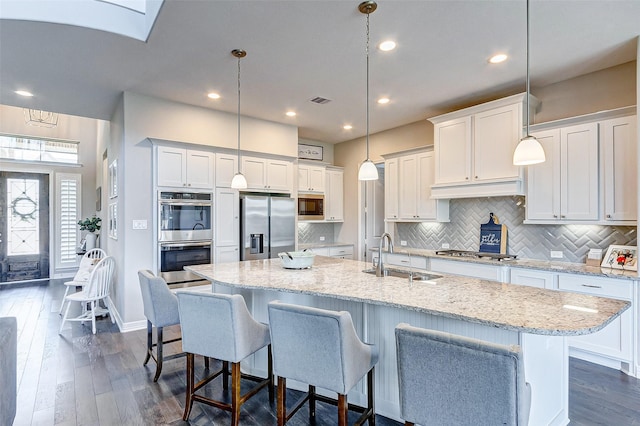 28606 Royal Pines Ct, Fulshear, TX 77441 - kitchen with appliances with stainless steel finishes, white cabinets, decorative backsplash, and recessed lighting