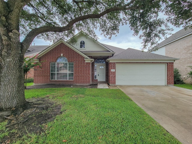 15311 Streetcar Ct, Cypress, TX 77429 - view of front of house featuring an attached garage, concrete driveway, a front yard, and brick siding