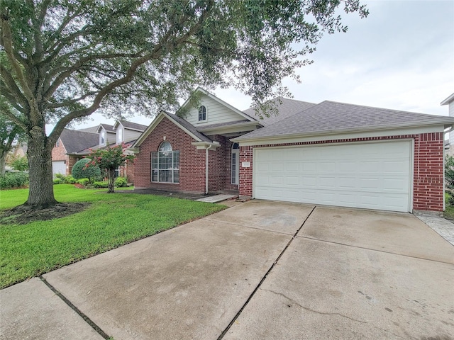 15311 Streetcar Ct, Cypress, TX 77429 - view of front of house featuring brick siding, concrete driveway, a front lawn, an attached garage, and a shingled roof