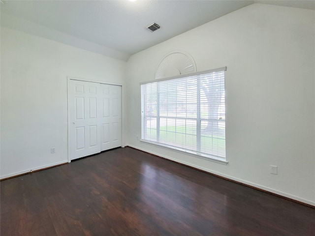 15311 Streetcar Ct, Cypress, TX 77429 - unfurnished bedroom featuring lofted ceiling, dark wood finished floors, and a closet