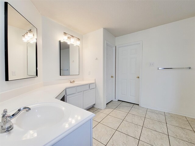 15311 Streetcar Ct, Cypress, TX 77429 - bathroom featuring double vanity and tile patterned floors
