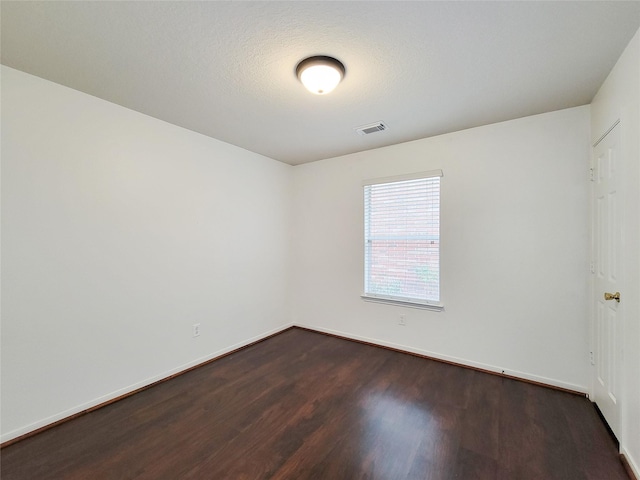 15311 Streetcar Ct, Cypress, TX 77429 - spare room with dark wood-style flooring and baseboards