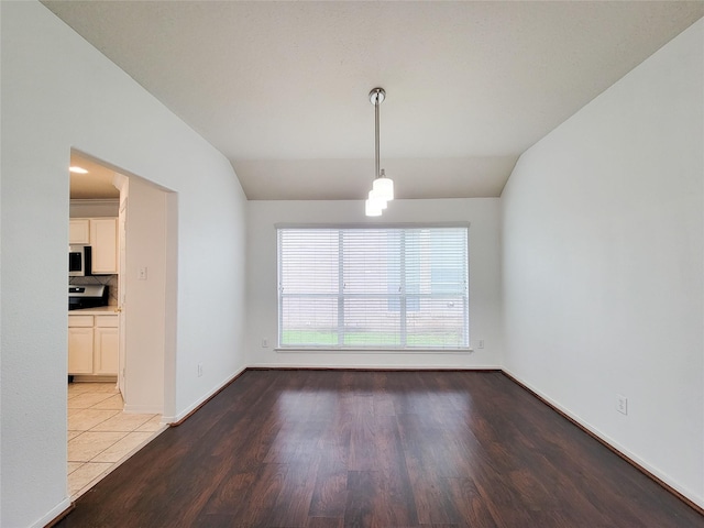 15311 Streetcar Ct, Cypress, TX 77429 - unfurnished dining area with lofted ceiling and wood finished floors