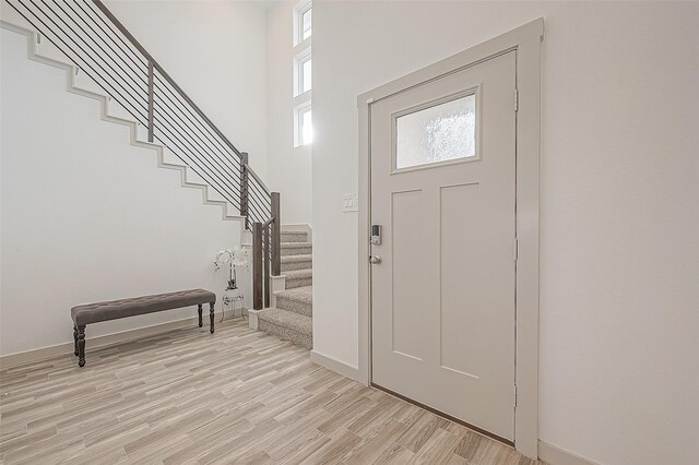 1815 Sandy Trail Ln, Rosenberg, TX 77469 - entrance foyer with stairway, light wood finished floors, and a towering ceiling