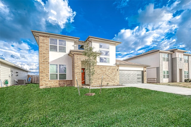 1815 Sandy Trail Ln, Rosenberg, TX 77469 - view of front of home featuring concrete driveway, stucco siding, an attached garage, and brick siding