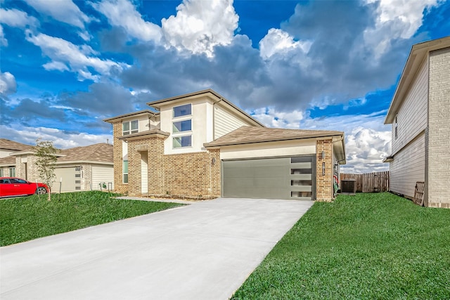 1815 Sandy Trail Ln, Rosenberg, TX 77469 - view of front of house with brick siding, concrete driveway, a garage, and stucco siding