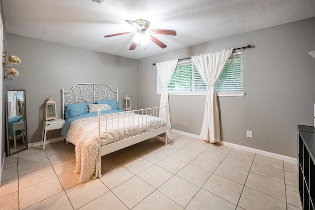15638 Charolais Dr, Cypress, TX 77429 - bedroom with light tile patterned floors and a ceiling fan