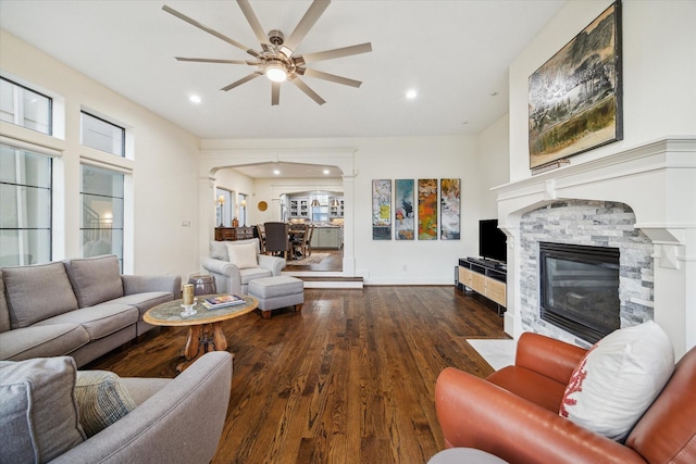 6410 Rodrigo St Unit B, Houston, TX 77007 - living area featuring ceiling fan, a fireplace, wood finished floors, arched walkways, and recessed lighting