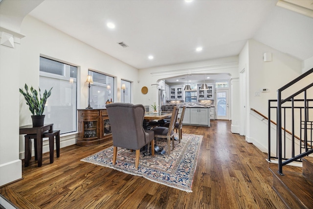 6410 Rodrigo St Unit B, Houston, TX 77007 - dining room with arched walkways, dark wood-style flooring, stairs, and recessed lighting