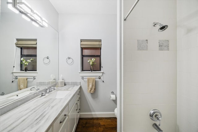 6410 Rodrigo St Unit B, Houston, TX 77007 - bathroom featuring wood finished floors, vanity, and washtub / shower combination