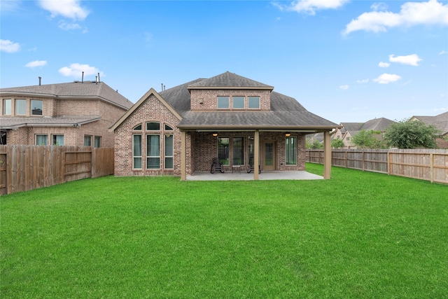 3834 Trophy Ridge Dr, Spring, TX 77386 - rear view of property with a fenced backyard, a patio area, brick siding, and a shingled roof