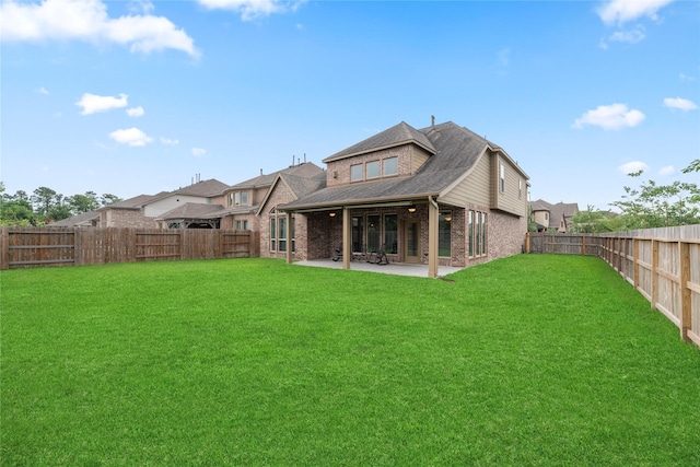 3834 Trophy Ridge Dr, Spring, TX 77386 - rear view of property featuring brick siding, a patio area, a fenced backyard, and roof with shingles