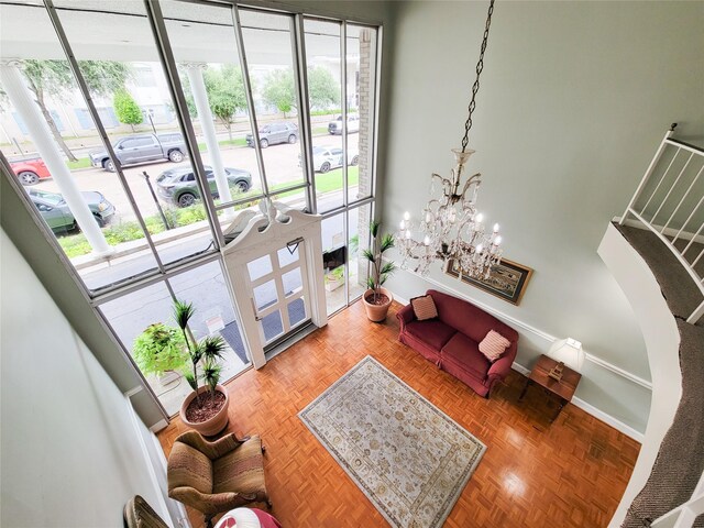 2600 Bellefontaine St Unit A21, Houston, TX 77025 - living room featuring healthy amount of natural light and a chandelier