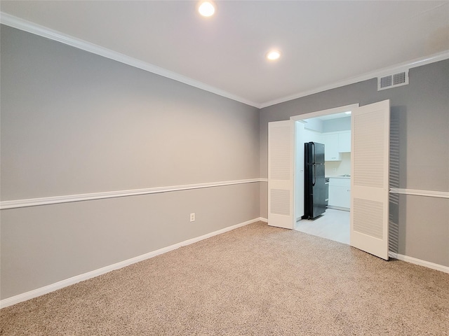 2600 Bellefontaine St Unit A21, Houston, TX 77025 - empty room featuring light colored carpet, crown molding, and recessed lighting