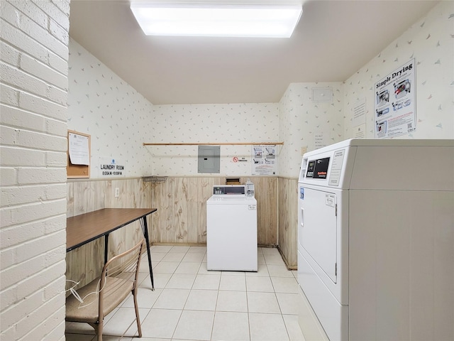 2600 Bellefontaine St Unit A21, Houston, TX 77025 - kitchen with wallpapered walls, a wainscoted wall, light tile patterned floors, washer and clothes dryer, and electric panel