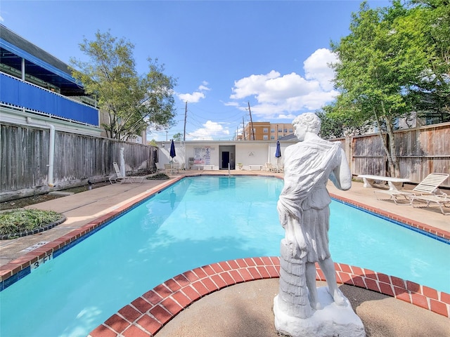 2600 Bellefontaine St Unit A21, Houston, TX 77025 - community pool featuring a fenced backyard and a patio area