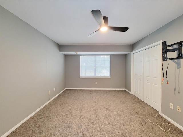 2600 Bellefontaine St Unit A21, Houston, TX 77025 - unfurnished bedroom featuring carpet, a closet, and ceiling fan