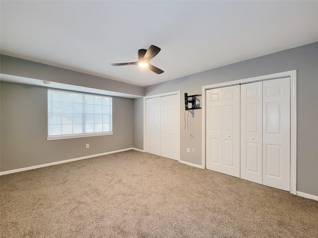 2600 Bellefontaine St Unit A21, Houston, TX 77025 - unfurnished bedroom with multiple closets, carpet floors, and a ceiling fan