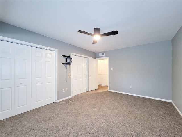 2600 Bellefontaine St Unit A21, Houston, TX 77025 - unfurnished bedroom with multiple closets, carpet floors, and ceiling fan