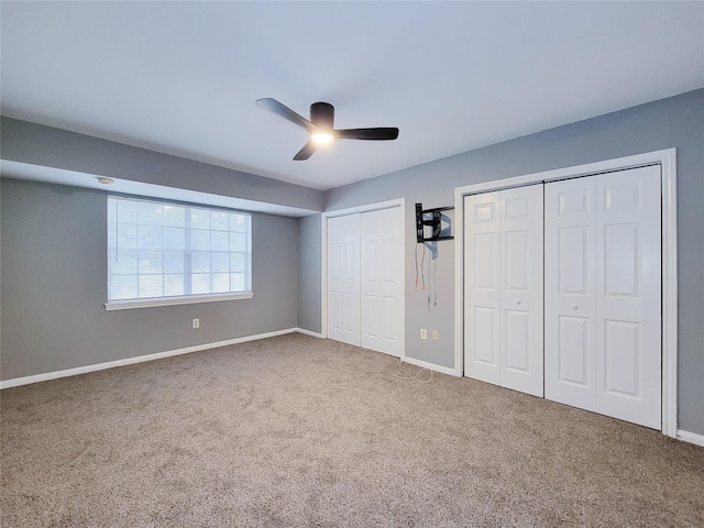 2600 Bellefontaine St Unit A21, Houston, TX 77025 - unfurnished bedroom with multiple closets, carpet, and a ceiling fan