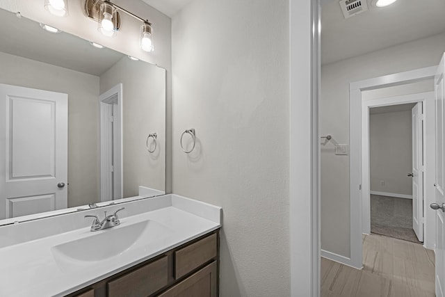 21521 Witham Promenade Ln, Magnolia, TX 77355 - bathroom with vanity and baseboards