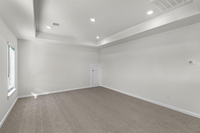 21521 Witham Promenade Ln, Magnolia, TX 77355 - empty room with a raised ceiling, carpet flooring, and recessed lighting