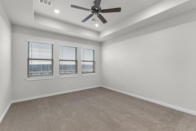 21521 Witham Promenade Ln, Magnolia, TX 77355 - carpeted empty room featuring a tray ceiling, ceiling fan, and recessed lighting