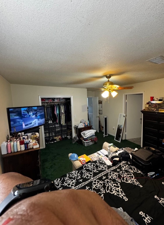 3201 Stallings Dr, Houston, TX 77088 - bedroom with a textured ceiling, carpet flooring, a ceiling fan, and a closet