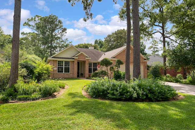 31 N Winterport Cir, The Woodlands, TX 77382 - single story home featuring brick siding, a front lawn, concrete driveway, a chimney, and a garage