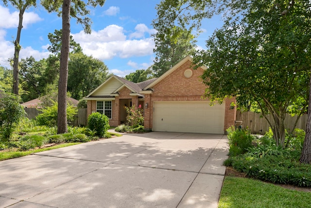 31 N Winterport Cir, The Woodlands, TX 77382 - ranch-style home with brick siding, a garage, and driveway